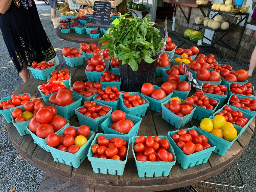 Ripe tomatoes are laid out one recent summer season. Coll Walker always tried to start his tomatoes early, in greenhouses, so they'd be ready early in the summer season. There's not much better than a juicy summer tomato, he told a reporter.